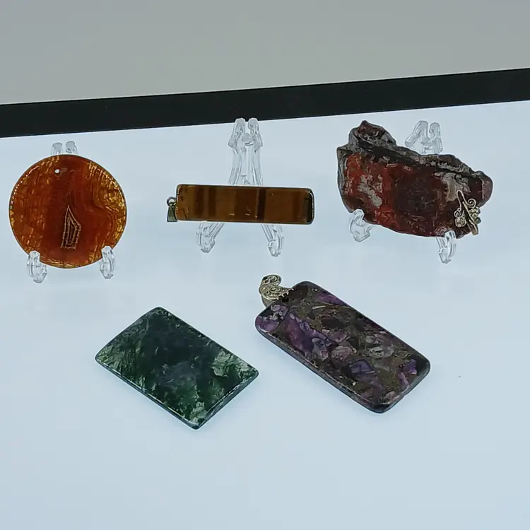 Five Polished Gemstone Pendants