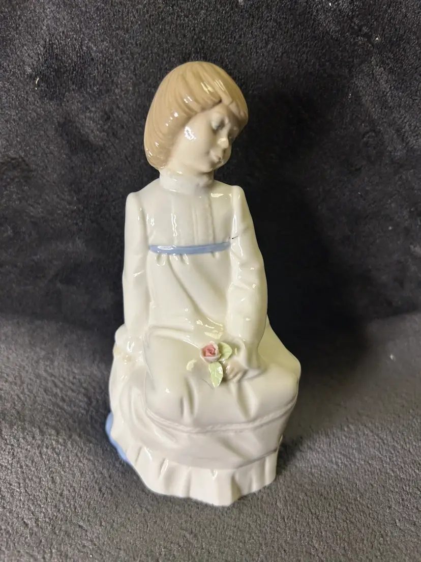 1986 Nadal Porcelain Figurine Girl Sitting  With a Rose The Last Firing