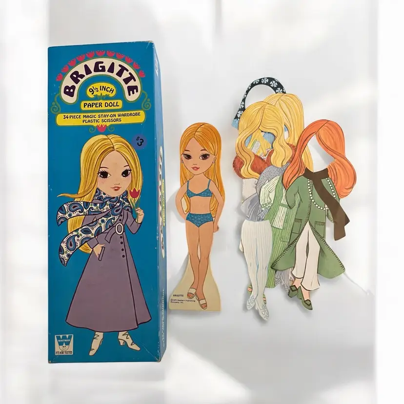 Vintage 1971 Brigitte Paper Doll Set. Whitman 9 1/2” Paper Doll w 34 Piece Magic Stay On Wardrobe. Original Box.