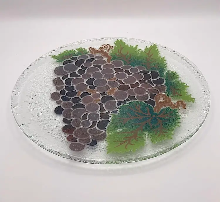Peggy Karr, signed, fused glass plate with grapes/vines/leaves, 11” in diameter