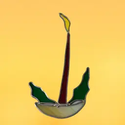 27. Vintage Christmas stain glass candle suncatcher.