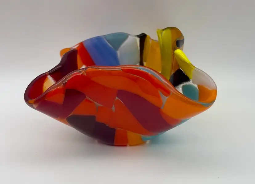 Vintage multicolor fused glass handkerchief dish.