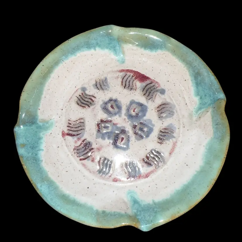Pottery Bowl With Peacock Like Pattern Glaze