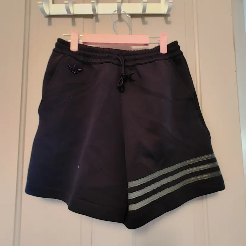 Men's shorts- Brand: Adidas. Size XS. Black shorts. NWT. Retail $50. 53% cotton, 47% polyester. No condition issues..
