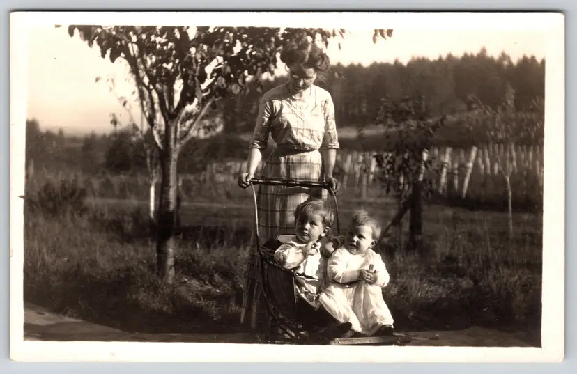 Postcard RPPC Babies in a Pram Pushed by Woman in Glasses Real Photo - 9124