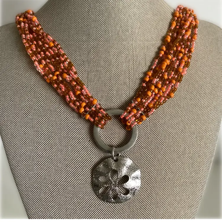 Multistrand Varied Coral Tone Glass Beaded Necklace With Silver Sand Dollar Pendant
