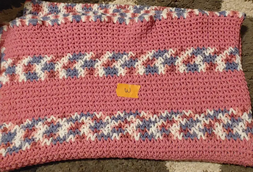 Afghan W- approx size 52 x 80. Pink stripe. As shown.