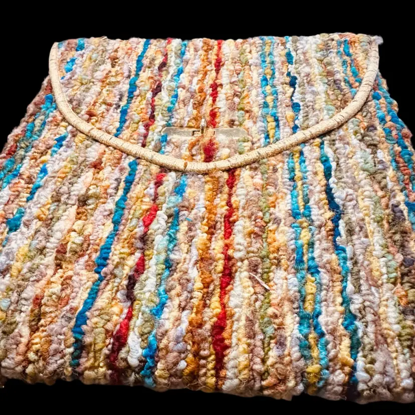 27. VTG 1960s Jerry Terrence carpet bag featuring a multi-colored striped shaggy textile