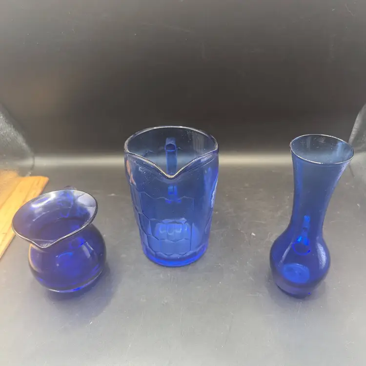Vintage Lot of 3 Glass Pitchers 2 Hand Blown Cobalt Blue Glass Creamer and Pitcher With Clear Handles and One Shirley Temple Mini Pitcher.