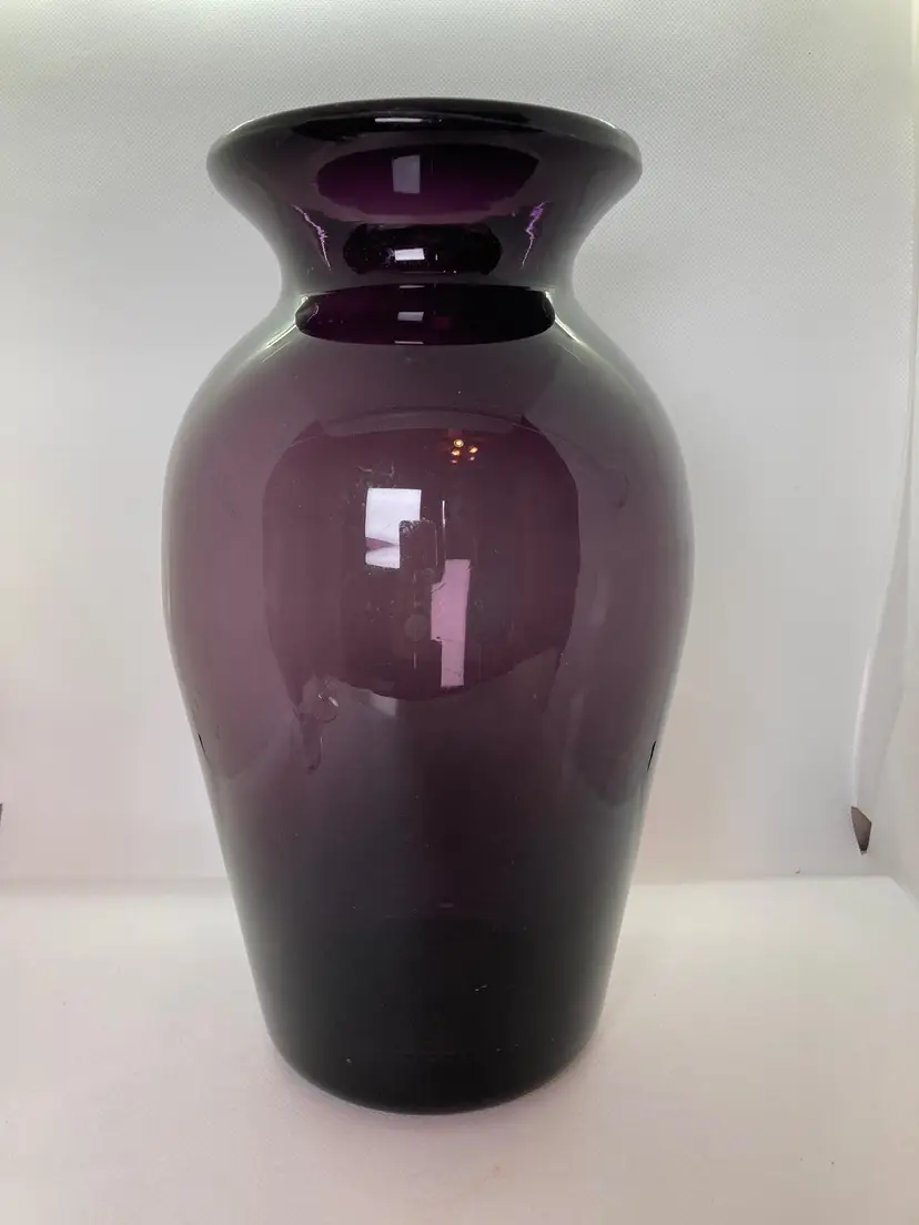 Heavy glass vase 
hand blown 
purple / amethyst 
with a few bubbles