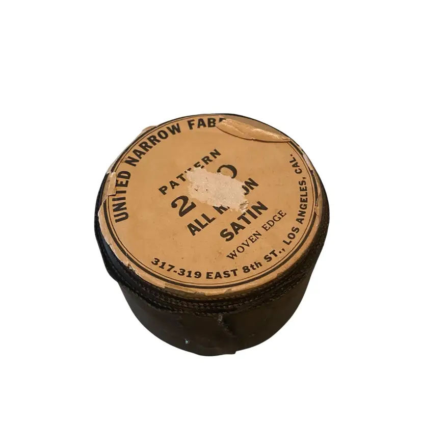 This is a vintage spool of black satin ribbon