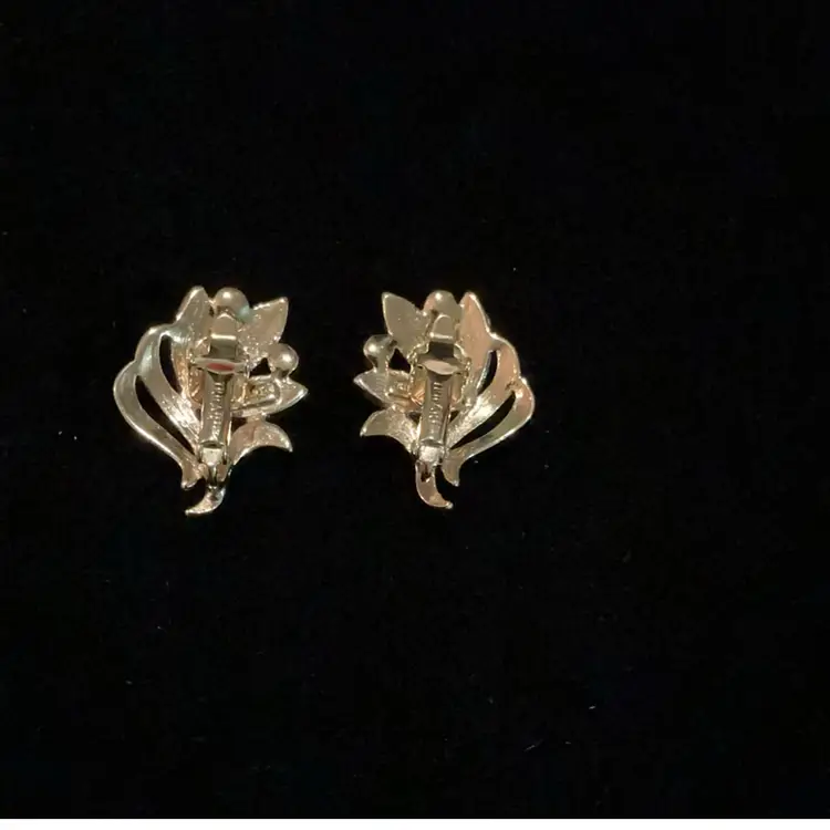 Goldtone Cream Enamel Trifari  Floral Clip On Earrings.