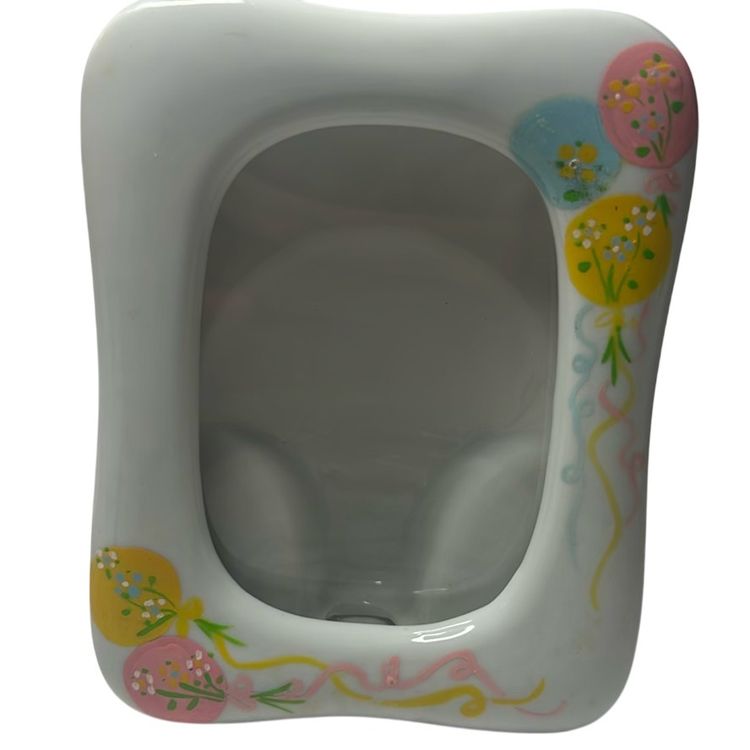 Vintage Porcelain Picture Frame With Hand Painted Pastel Balloons Pink, Yellow,
Blue.
Made By Takahashi - Based In San Francisco- 1989’s “chime” No Damage & Measures 5.5” Tall & 4” Wide