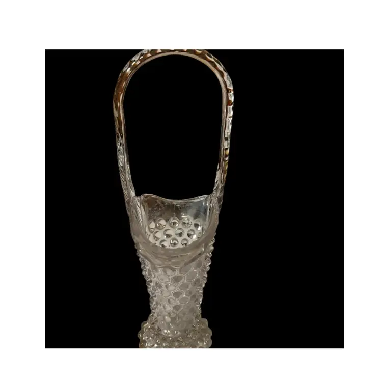 This item is a vintage glass basket vase with Green Glow