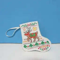 completed handmade cross stitch small Christmas stocking ornament reindeer