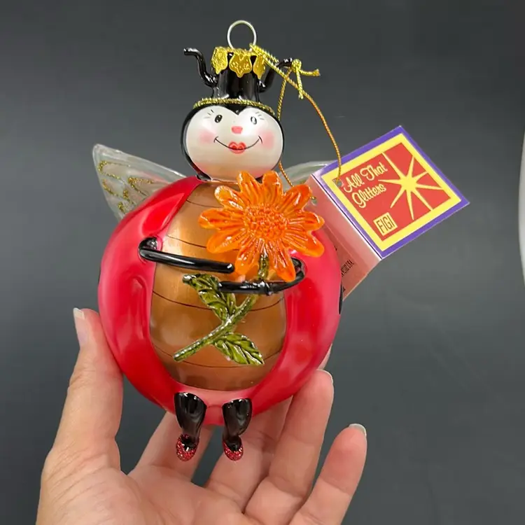 Vintage Handcrafted By Figi Lady Bug Holding A Sun Flower Blown Glass Ornament With Wings.  6” T Had Tags And Original Tag 2002