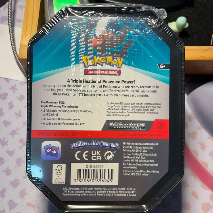 Pokémon TCG Triple Whammy Collector Tin featuring the legendary Pokémon Darkrai.