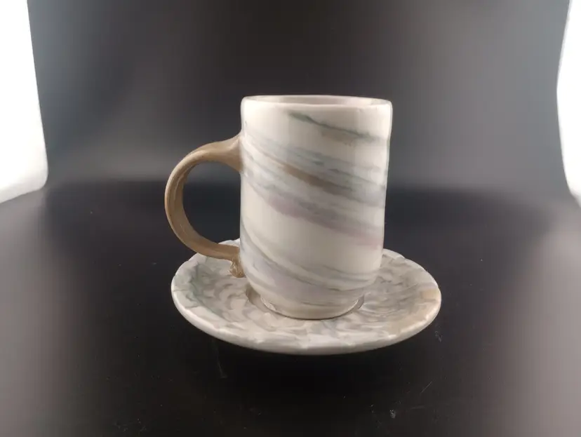 Studio pottery mug and saucer