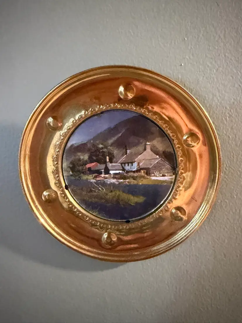 Vintage 1950's solid brass wall plate featuring foil art. Depicting English Cottage scenes. Made in England. ~5.75”
