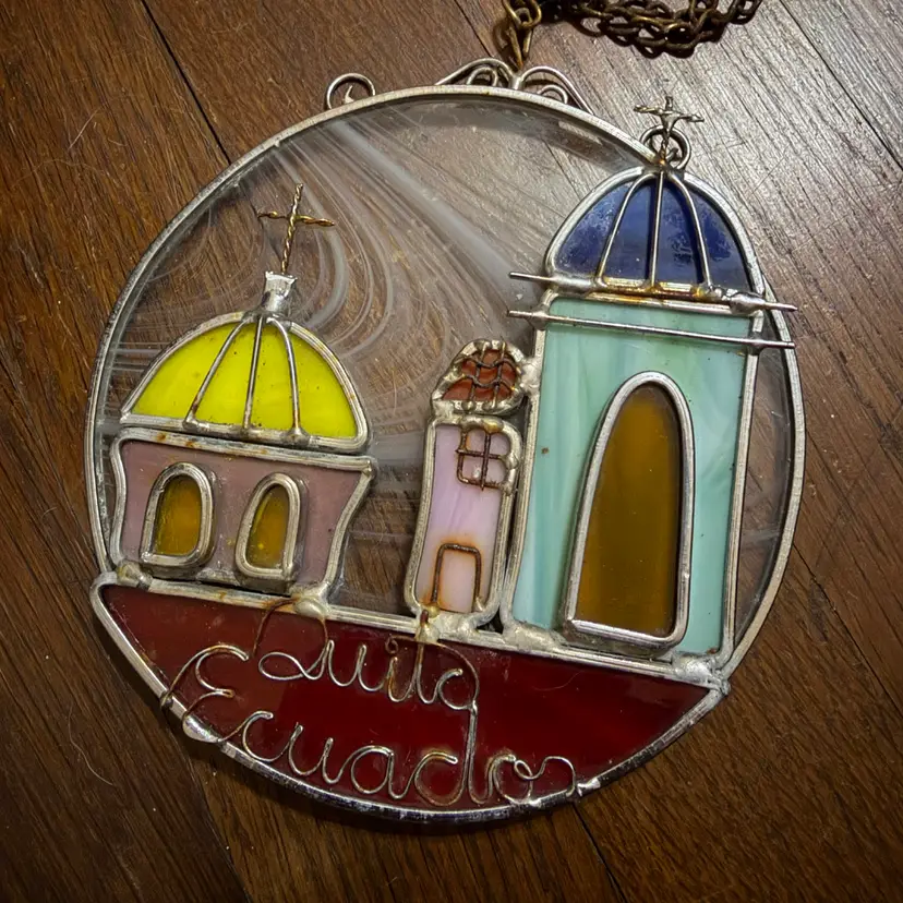 Stained glass suncatcher depicts the skyline of Quito, Ecuador