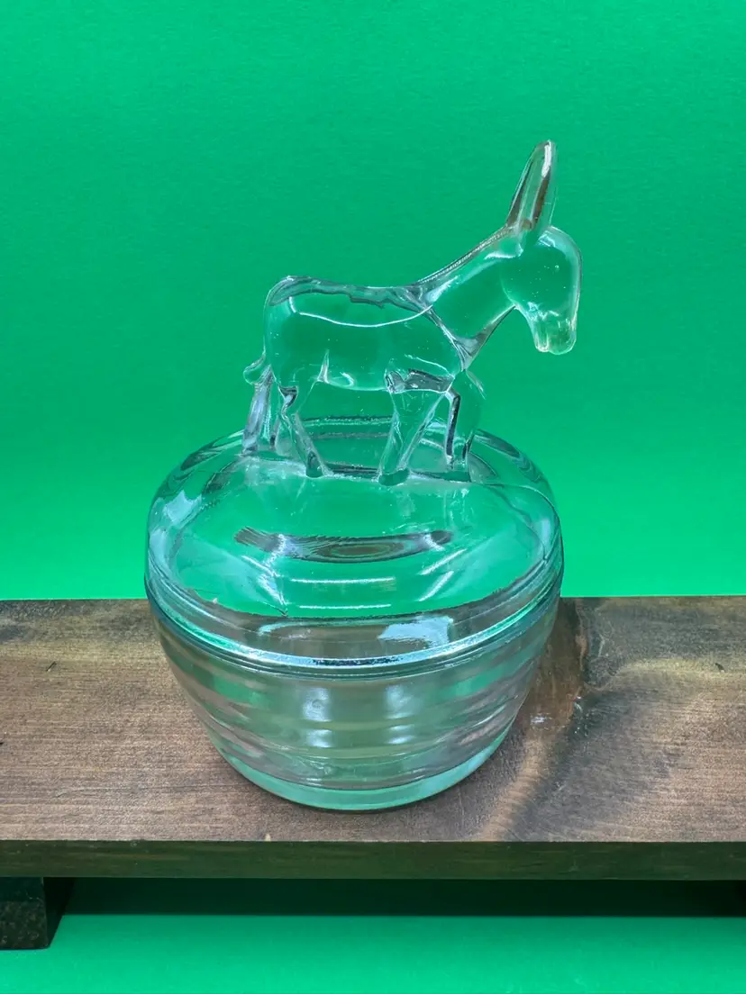 Clear pressed glass lidded trinket jar with a donkey finial by Jeannette Glass, Circa 1940-50s,5” Tall