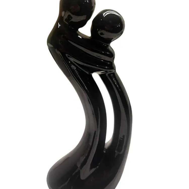 Vintage 1999 Avery Creations Statue Figurine Glossy black ceramic abstract couple in a Loving embrace. modernistic, flowing lines. Apx 10”