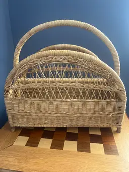 #01 Vintage woven rattan magazine rack with arched handle.16” Wide 16” Tall 7.5 “ Wide