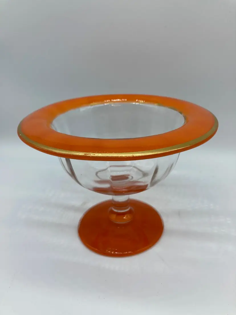 Orange rimmed compote with gold on edge, from Czechoslovakia.