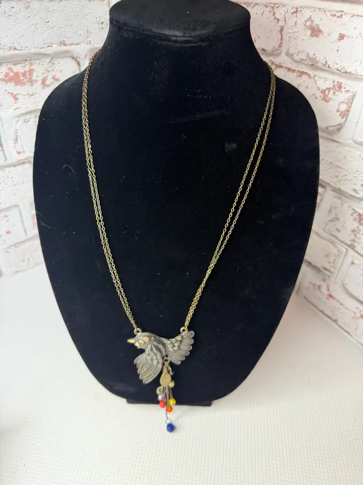 Bird Necklace Tag Says Ice