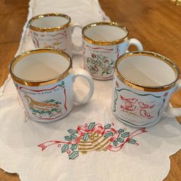 Beautiful Vintage Twelve Days of Christmas Mugs made in England By TAMS.  Features 3 Song Motifs on each mug with gold accents.  Perfect for Christmas Morning Brunch!
