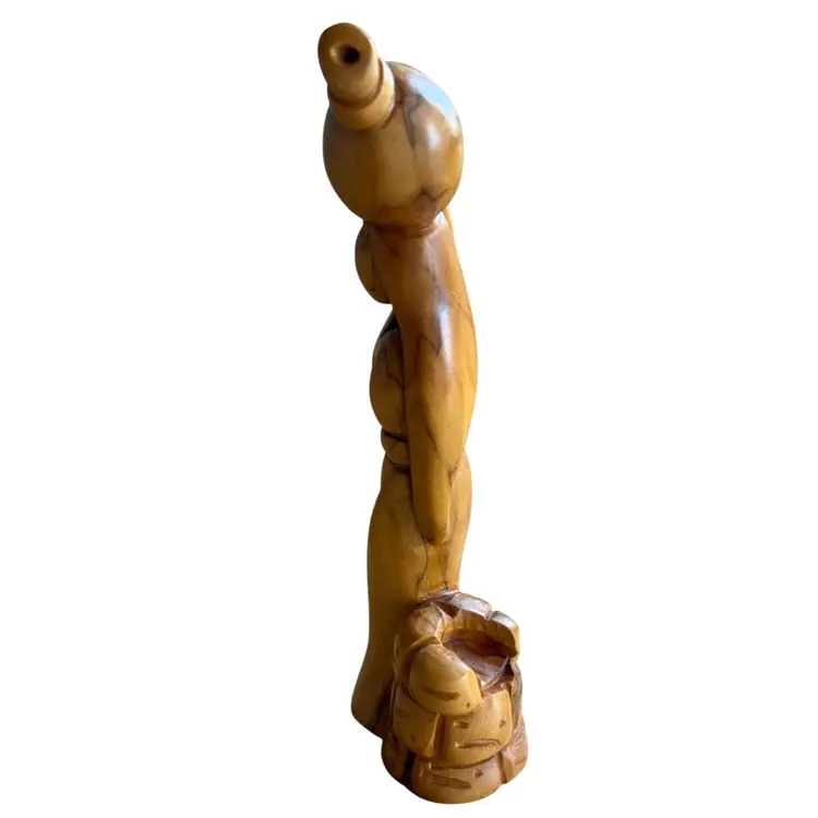 hand-carved olive wood sculpture depicting the biblical scene of the Samaritan woman at the well, traditionally crafted by Christian artisans in Bethlehem
