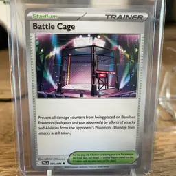 Battle Cage" Stadium Trainer card from the Pokémon Trading Card Game. Phantasmal Flames set