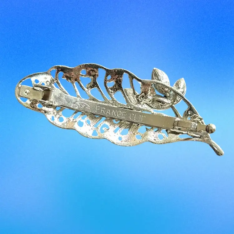Marked, “NS  FRANCE CLIP” Silver Tone Leave Barnett With White  And Colorful Rhinestones 2 3/4” L  X  1”