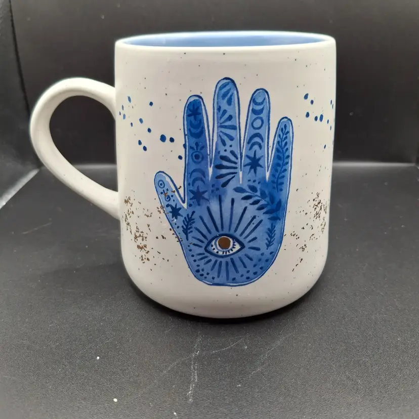 White Ceramic Mug With Blue Hand Evil Eye Design Speckled And Gold Accents
