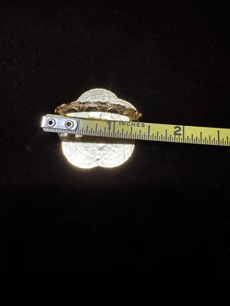 Vintage Scarf Clip featuring an enameled design of a king on a white elephant