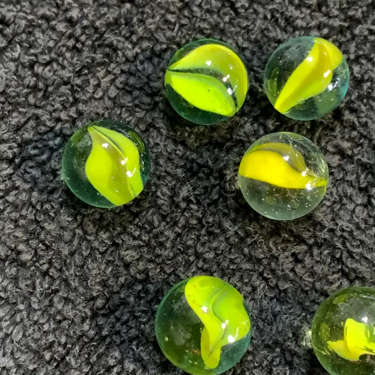 10-Clear w/Yellow Swirls Glass Marbles