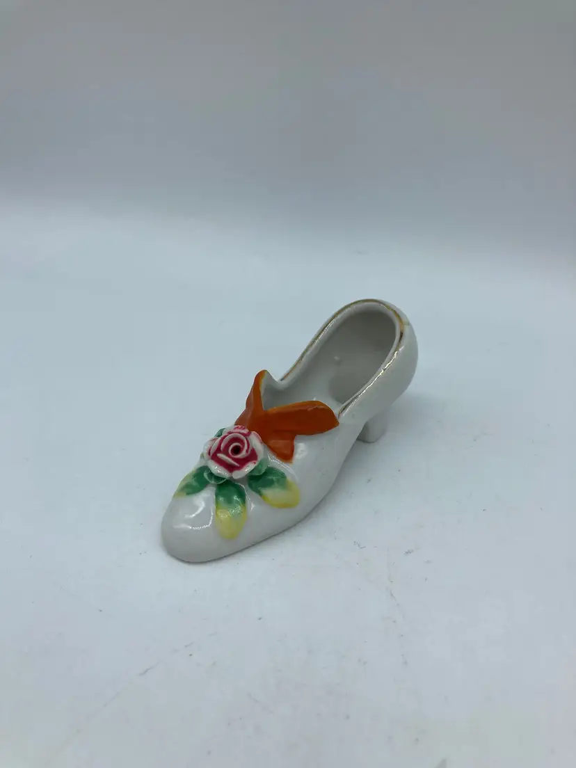Occupied Japan porcelain shoe figurine, pink rose with a bright orange bow