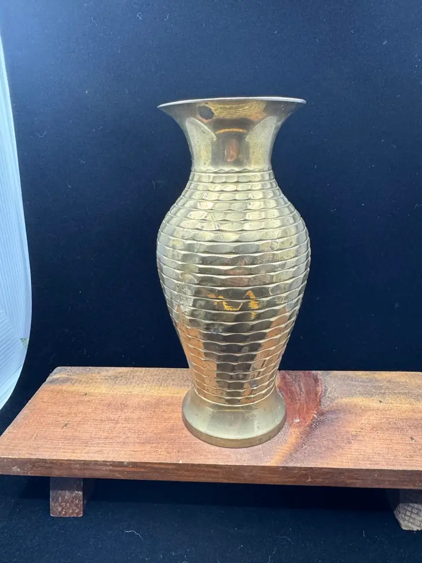 A vintage ribbed brass vase with a flared rim, 7”