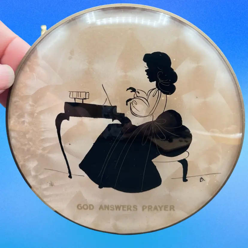 #170 Vintage Round Bubble/Convex Glass Reverse Painted Silhouette Picture  Woman Seated At A Desk Or Piano. ‘God Answered Prayers’ 5” In Diameter