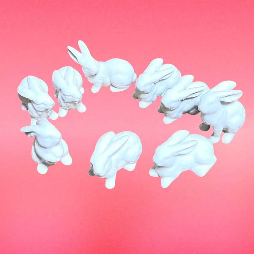 Set Of Nine White Ceramic Bunny Rabbits. 🐇 Approx 2-1/2” length and height.
