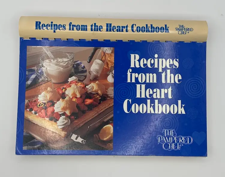 2 Pampered Chef Cookbooks. “Recipes from the Heart”1997.  “ Kitchen Is The Heart Of The Home.” 1999