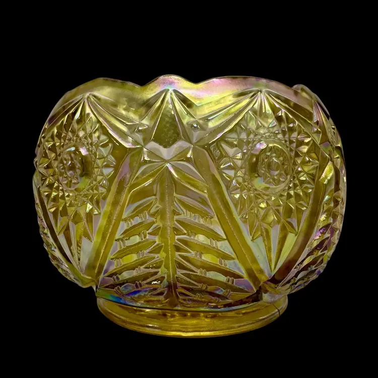 Vintage Carnival Glass Rose Bowl with a marigold or gold iridescent finish.