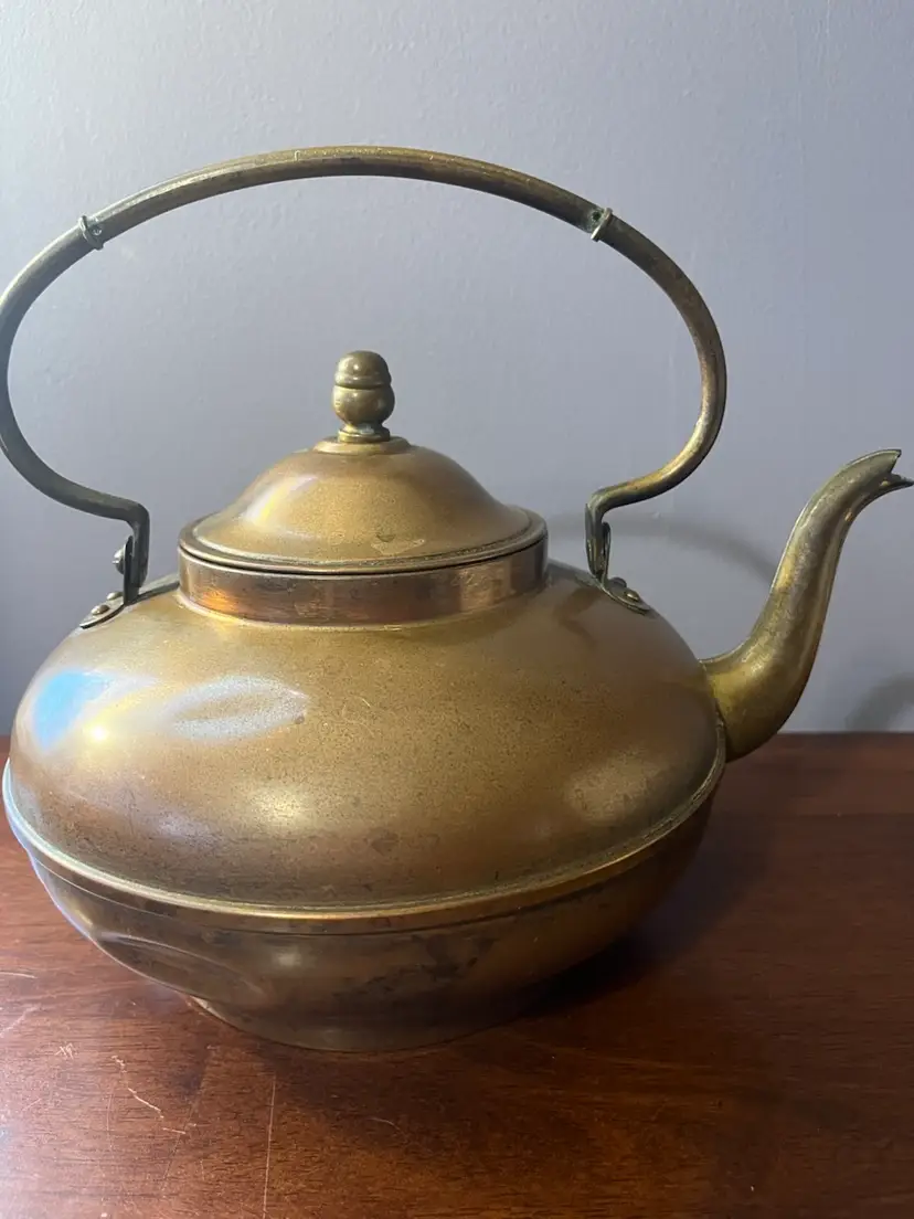 Antique copper gooseneck tea kettle with a curved handle and finial.  Marked Made In Holland. Circa Late 19th Century