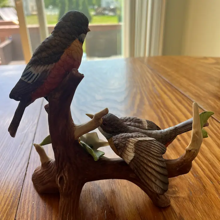 Royal Crown. Jonathan Byron bisque porcelain figurine of two robins on a branch. 8x8”