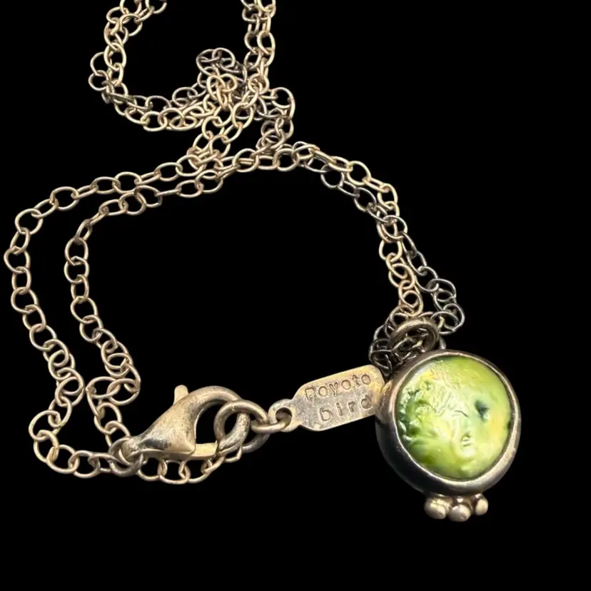 Native Peyote Bird vintage sterling silver necklace featuring a green gaspeite or turquoise pendant