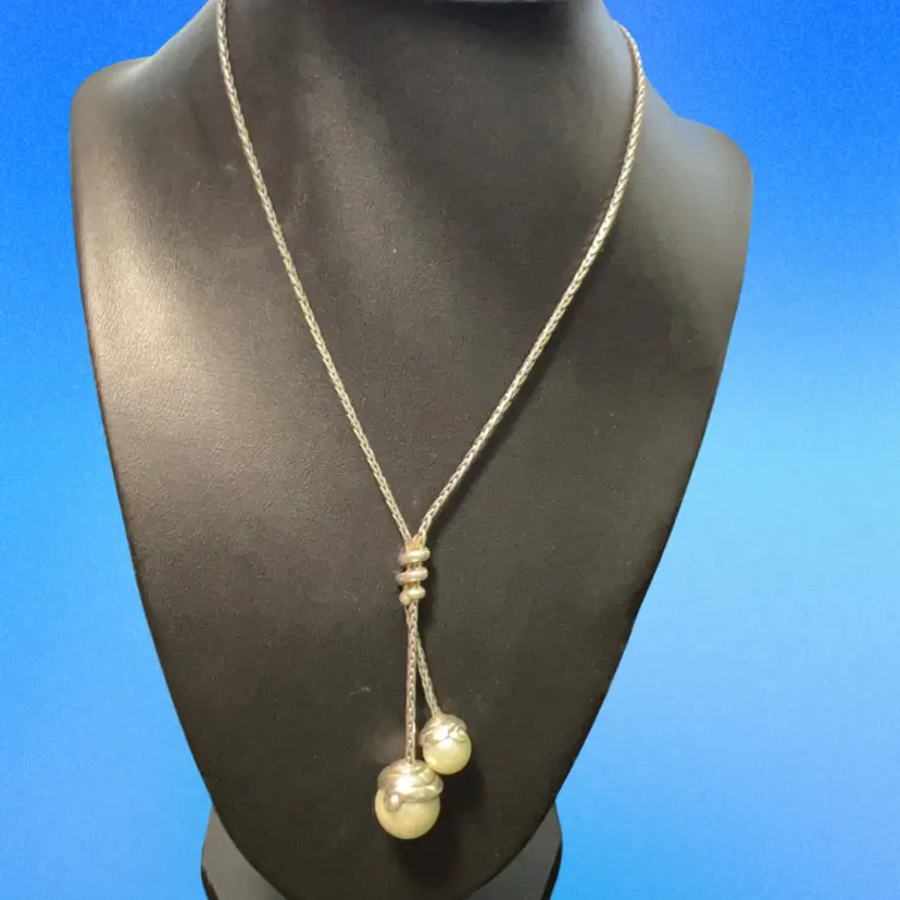 Brighton Twist lariat necklace features a silver-plated chain and two white faux pearls