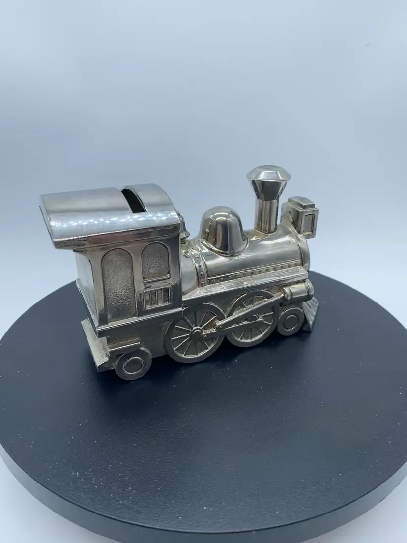 #3532 vintage silver-plated metal train-shaped piggy bank.