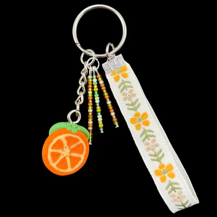 Handmade By Me - Orange Bag Charm With Orange & Green Seed Bead Strands And Flower Ribbon, Polymer Clay Orange Slice Charm Keychain, Keychain With Polymer Clay Orange Charm And Seed Bead Strands And Ribbon, Handmade Bag Charm, Handmade Purse Charm, Handmade Keychain, NN Artist Made