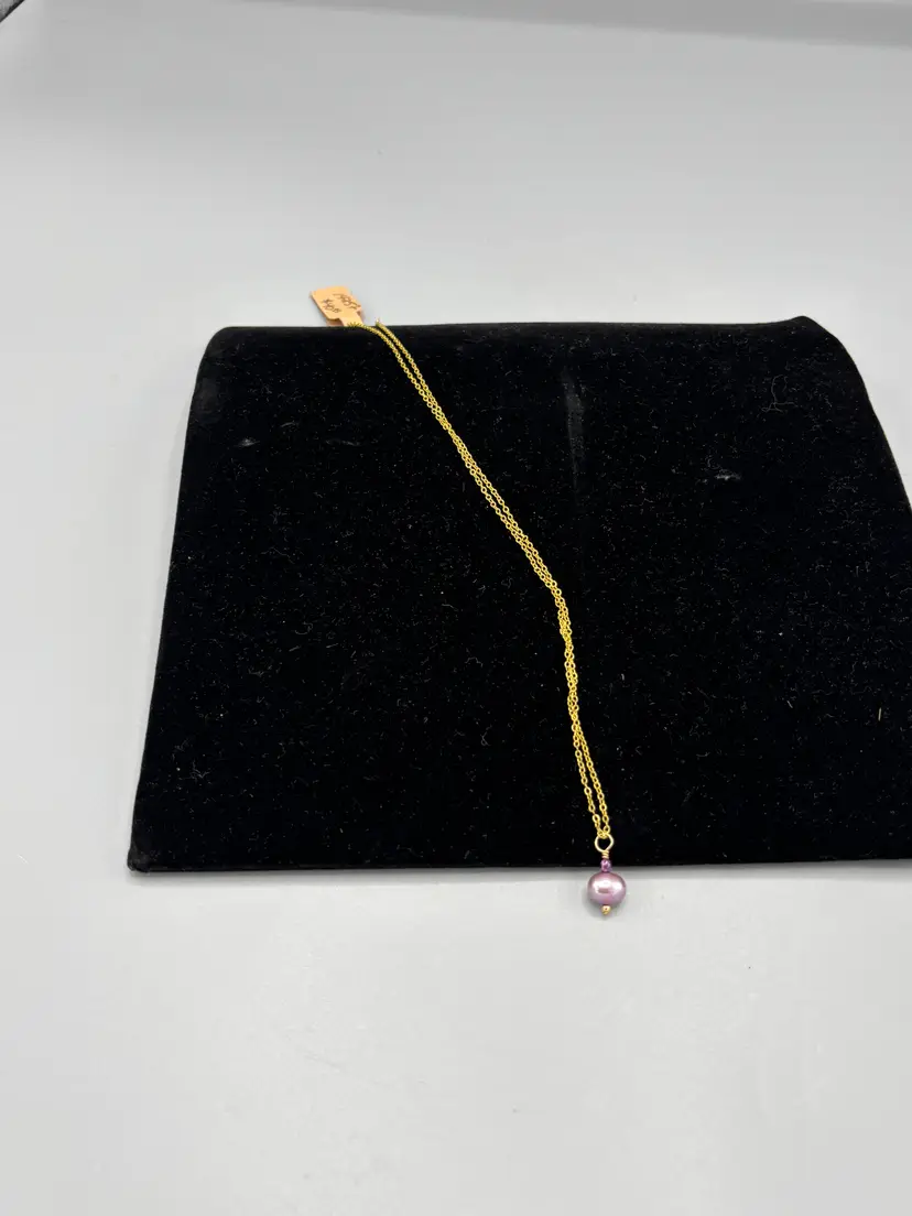 Gold tone with purple pearl