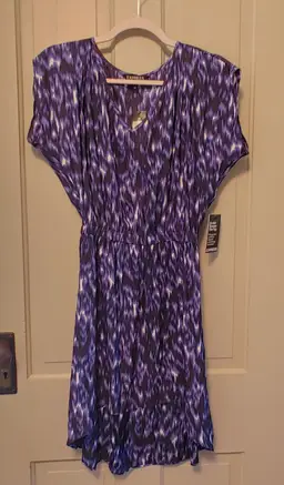 Dress- Brand: Express. Size XS. NWT. Retail $59.90. Black, blue, purple dress. Material- 100% polyester. No callouts.